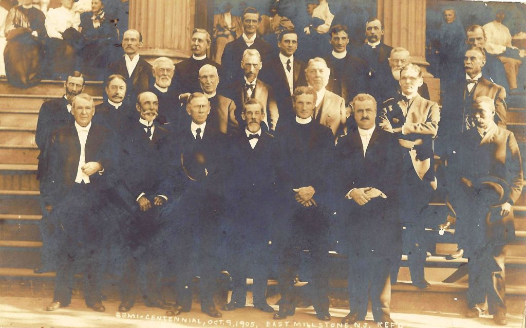 A picture of the pastors on the front steps in 1905. There's a curious man standing off to the side ...